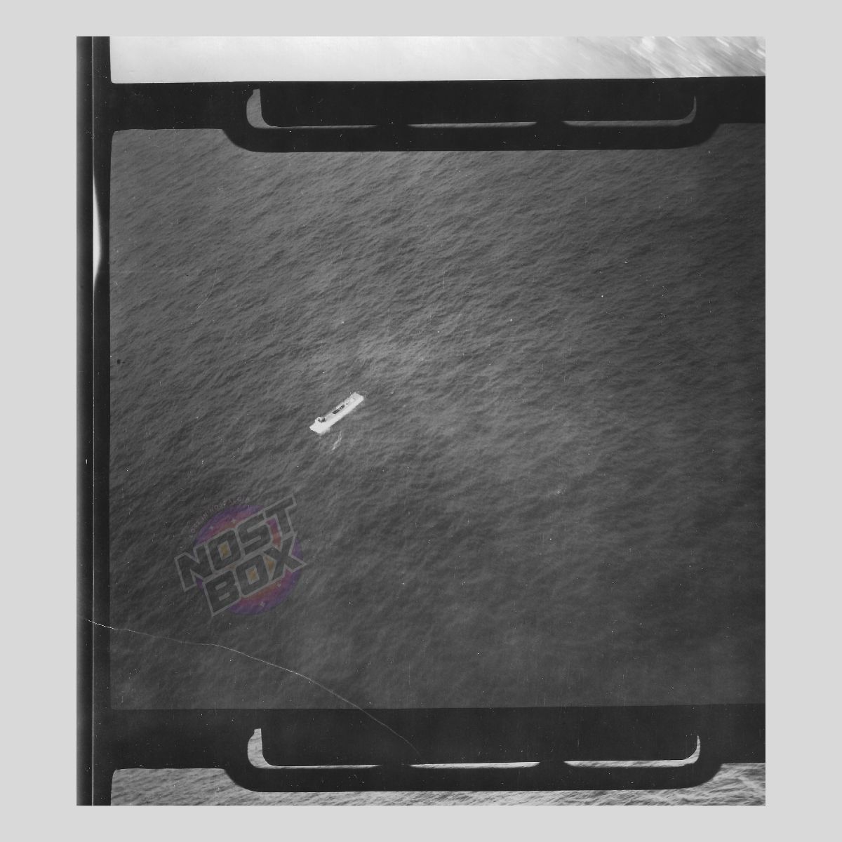 RAF Reconnaissance Photograph – Small Coastal Vessel at Sea (WWII Aerial Intel)