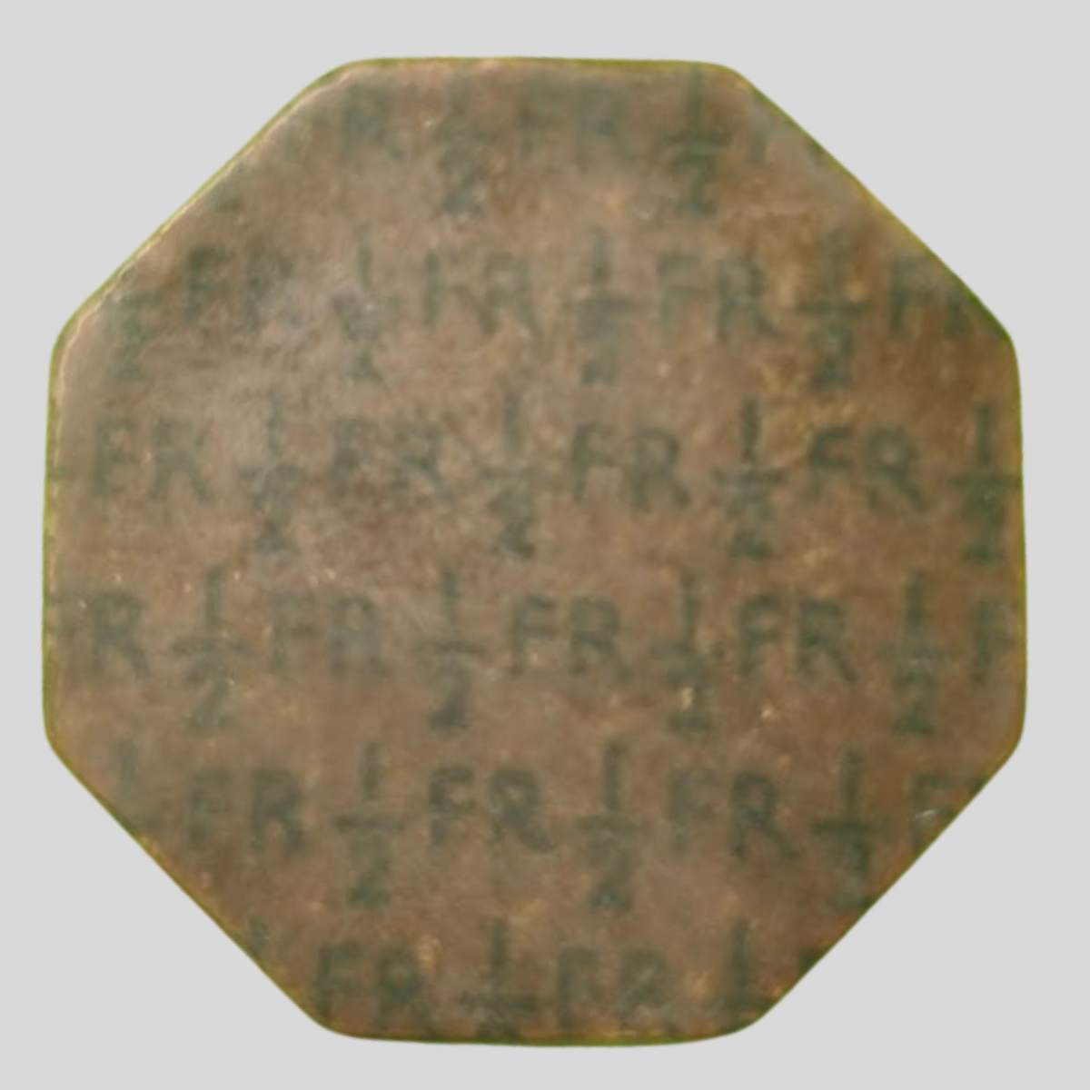 WWII NAAFI Fibre Token – Octagonal ‘FR ½’ Half Franc Issue Side 1