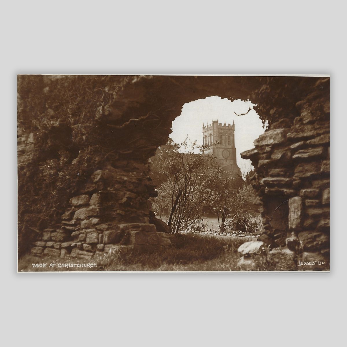 Christchurch Priory – View Through the Ruins (c.1920s Real Photo Postcard | Judges’ Ltd. | 7807)