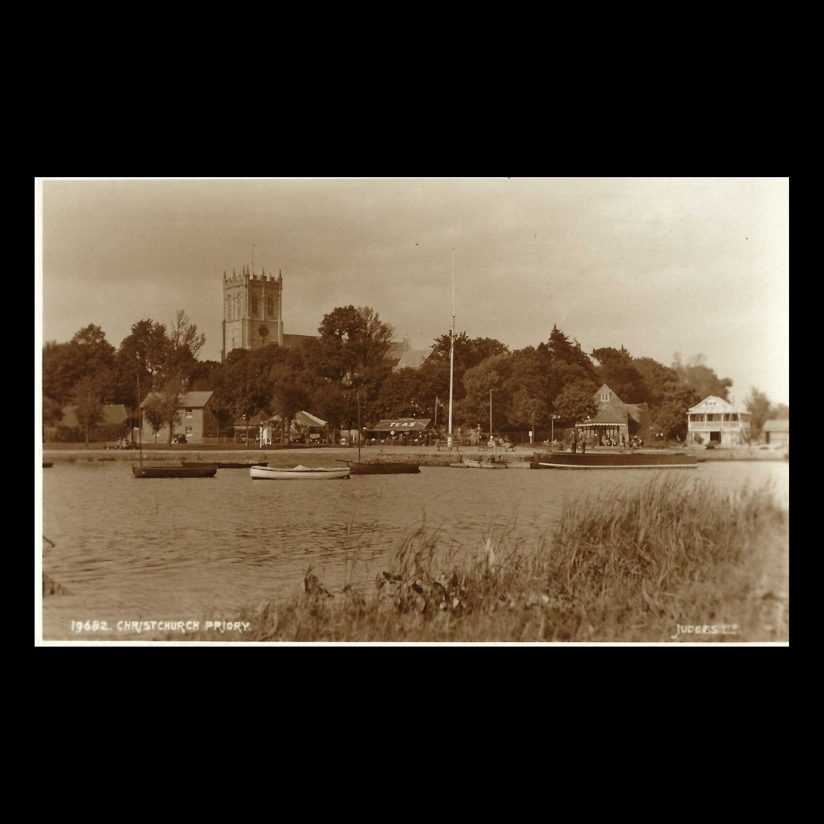 Christchurch Priory from the River Stour, Dorset (c.1920s–30s) | Judges Real Photo Postcard