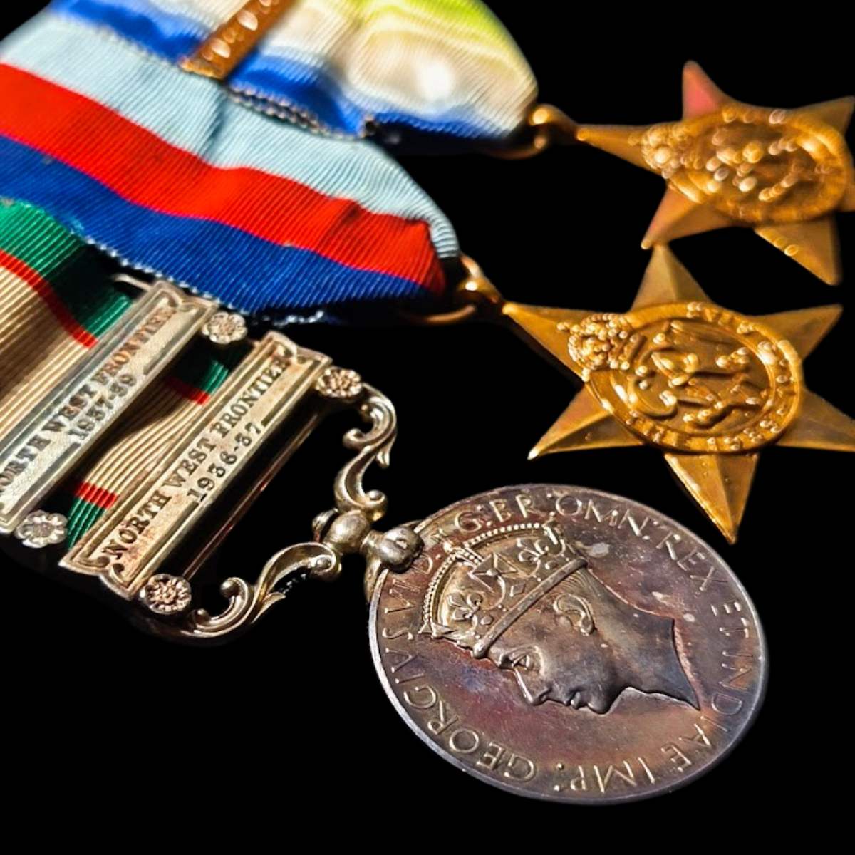 WWII RAF navigator medal group to J.C. Elphick showing India General Service Medal with North West Frontier clasps, 1939-45 Star and Africa Star with France and Germany clasp.
